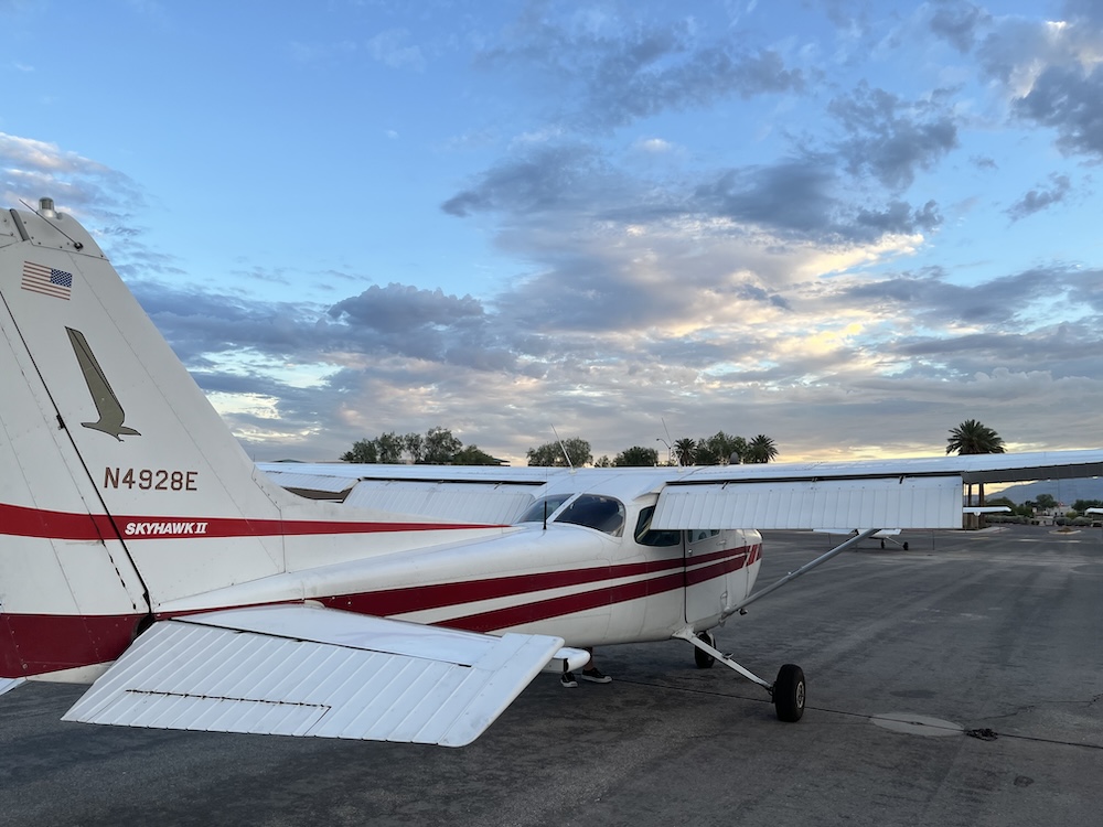 Single-engine airplane parked on the ramp