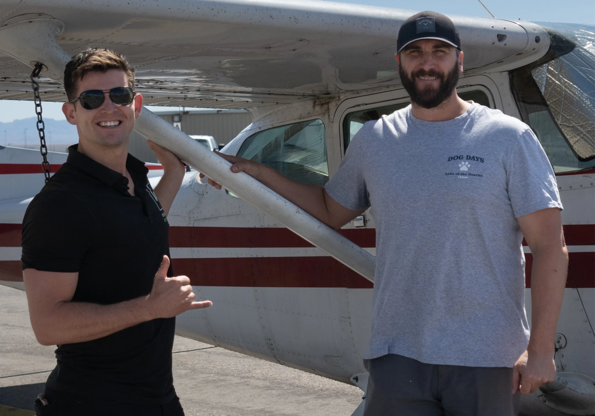 Vegas Aviation flight instructor and student standing in front of an airplane