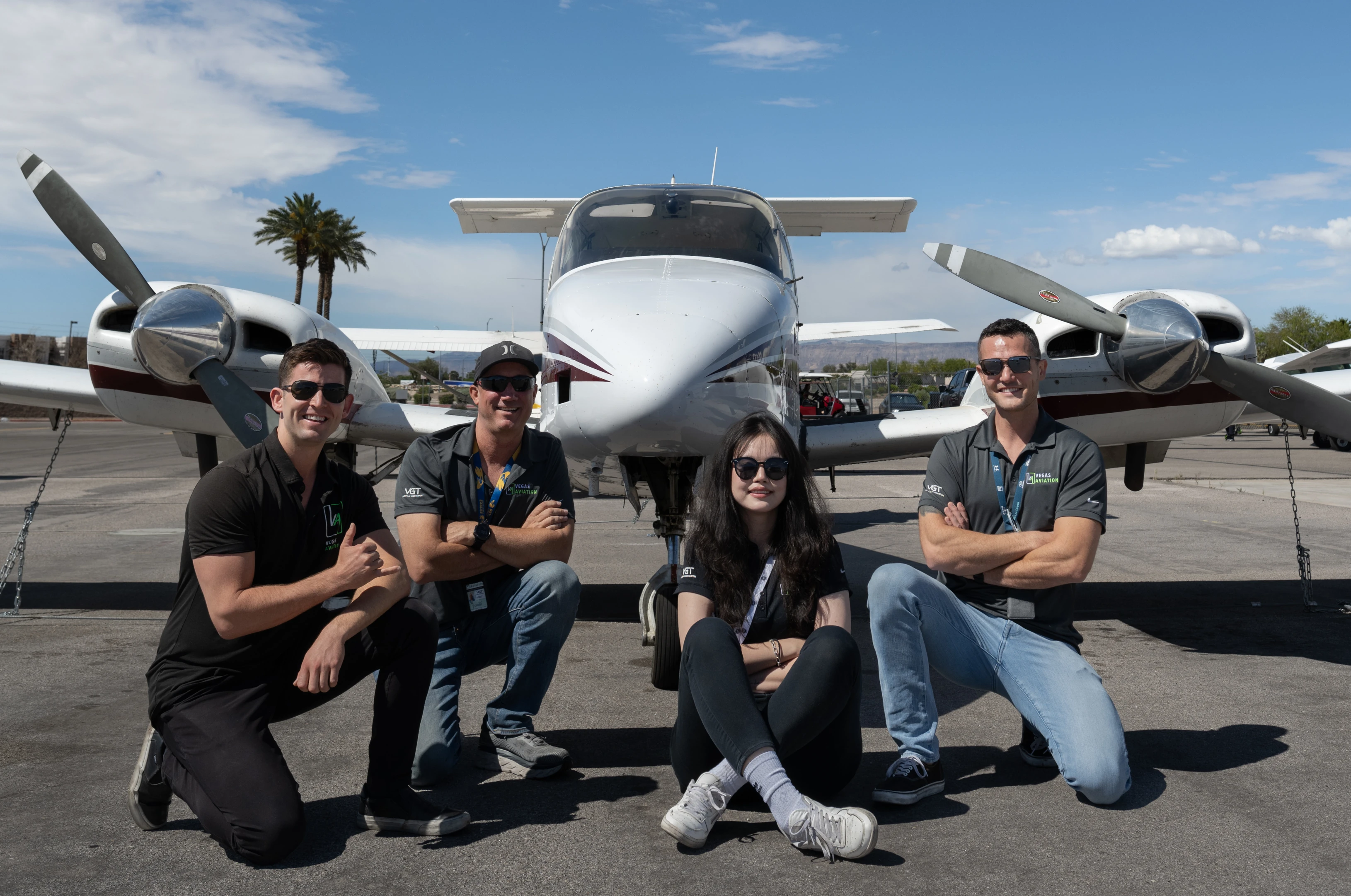 Vegas Aviation's CFIs posing in front of the Beechcraft Duchess